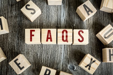 Wooden Blocks with the text Faqs